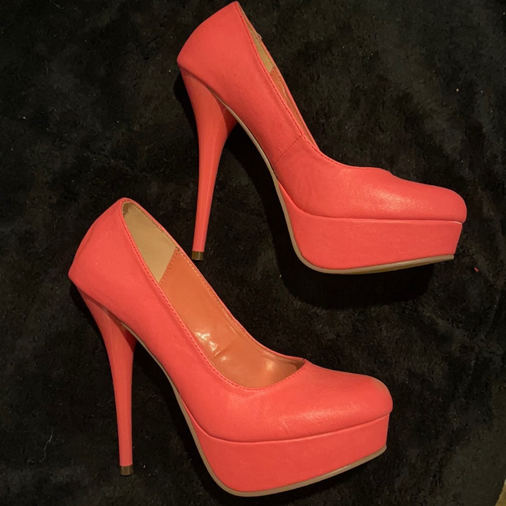 Hot pink platform pumps